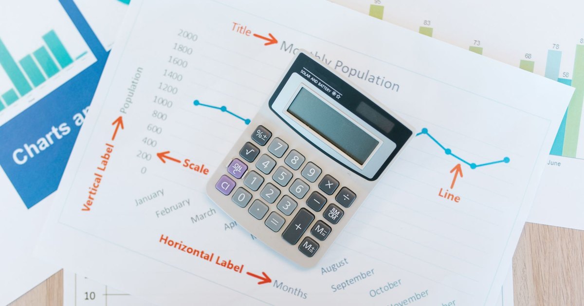 Calculator resting on financial paperwork on a desk